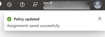 Intune notification toast reading Policy updated, Assignments saved successfully.